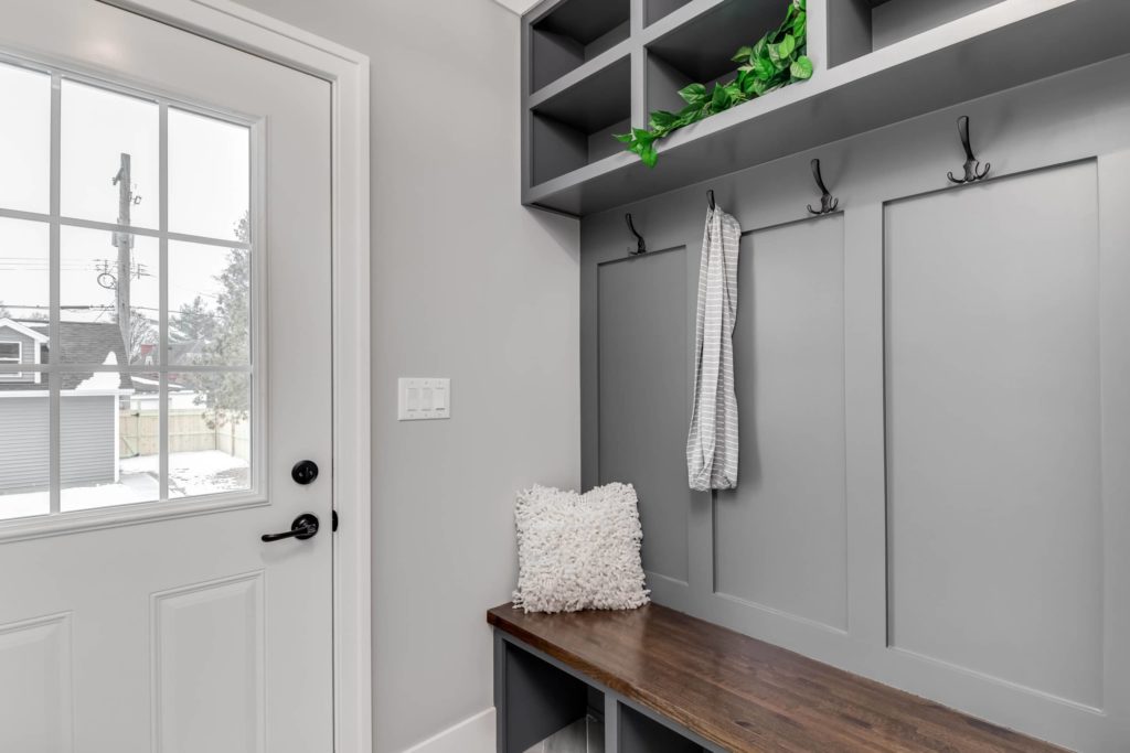 Gray mudroom with built in shelving houston