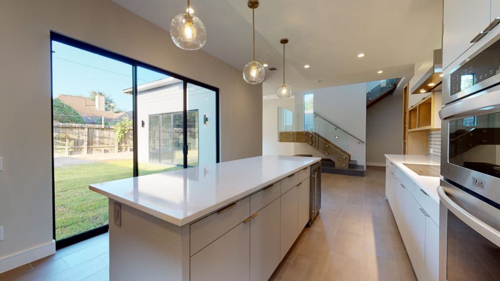 Custom-contemporary-kitchen-with-sliding-glass-doors-and-island-houston-memorial